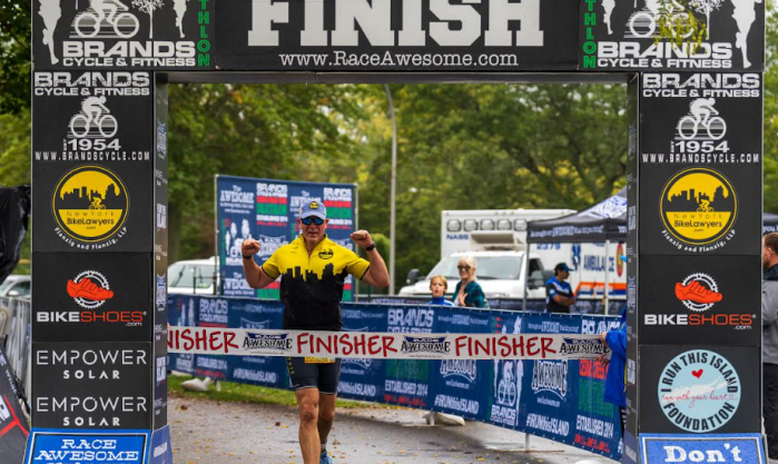 Daniel Flanzig at the finish line of a former Race Awesome event.